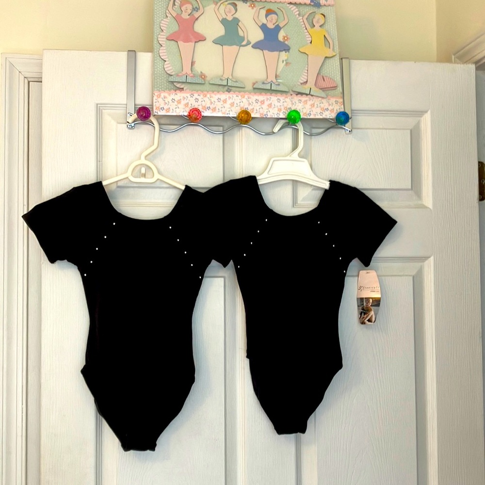 2 Black leotards new unworn and a ballet/ dance pop up cake stand